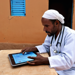 **Image Prompt:** A doctor in Djibouti using a tablet for a telemedicine consultation with a patient in a remote village. The background shows a basic, rural clinic setting contrasted with modern digital technology. Emphasis on the connection despite geographical barriers, showcasing the impact of telemedicine. Include traditional Djibouti clothing/textiles to root the scene in its location.